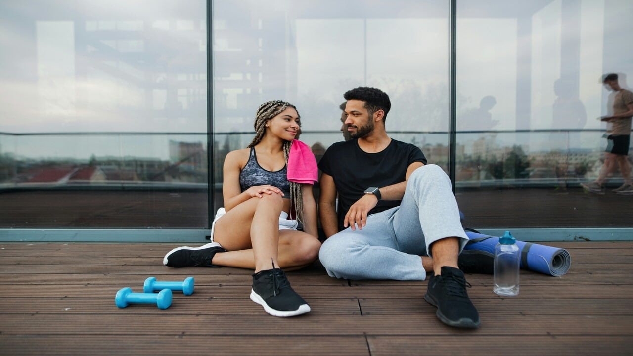 A couple resting after working out