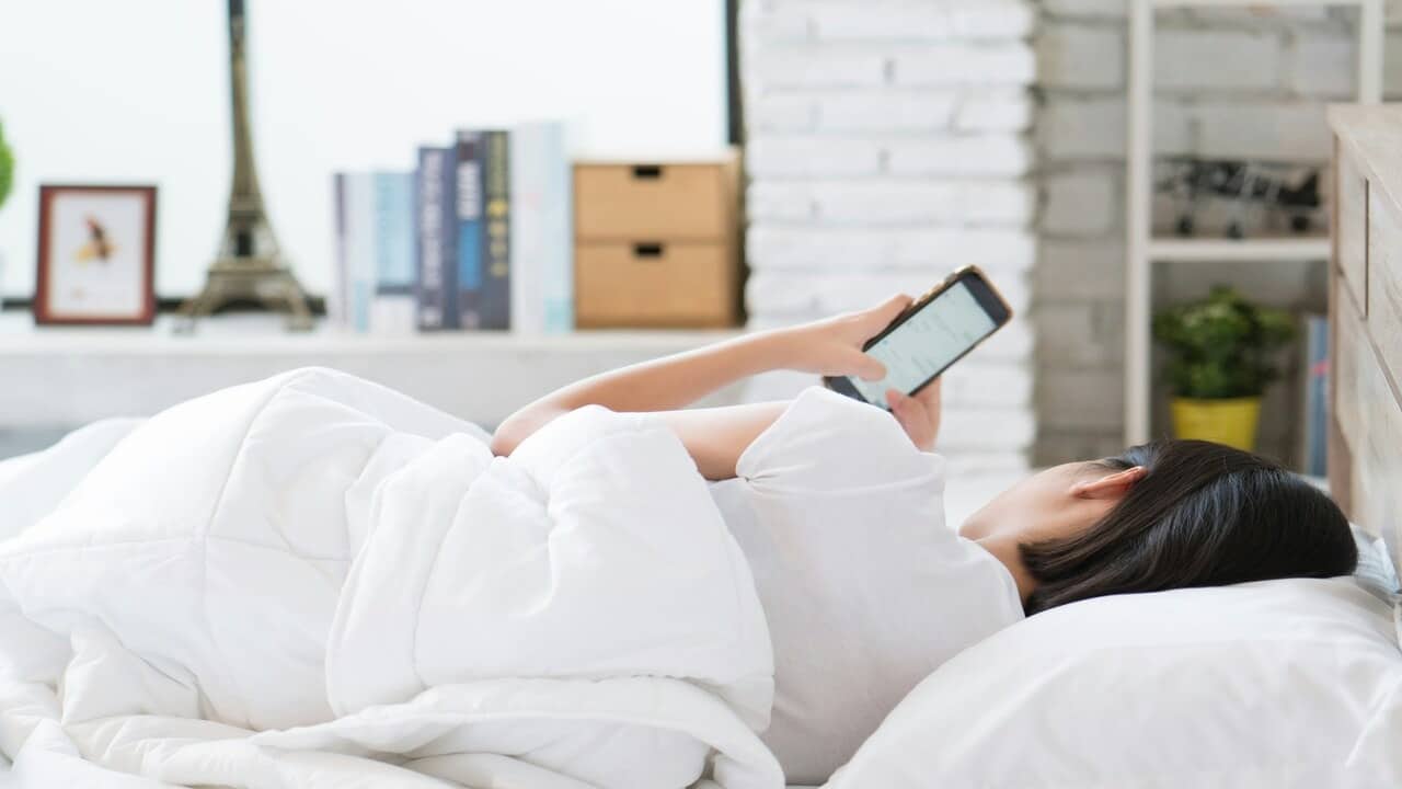 A woman waiting for a text