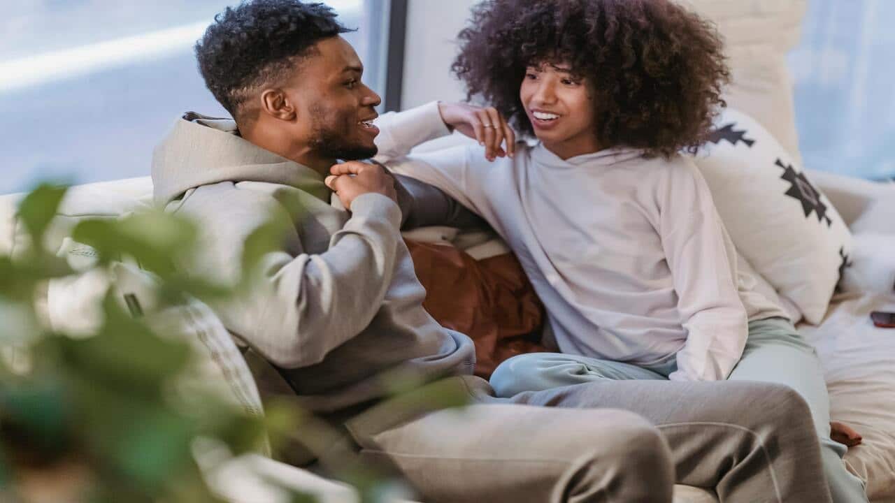 A couple talking while smiling