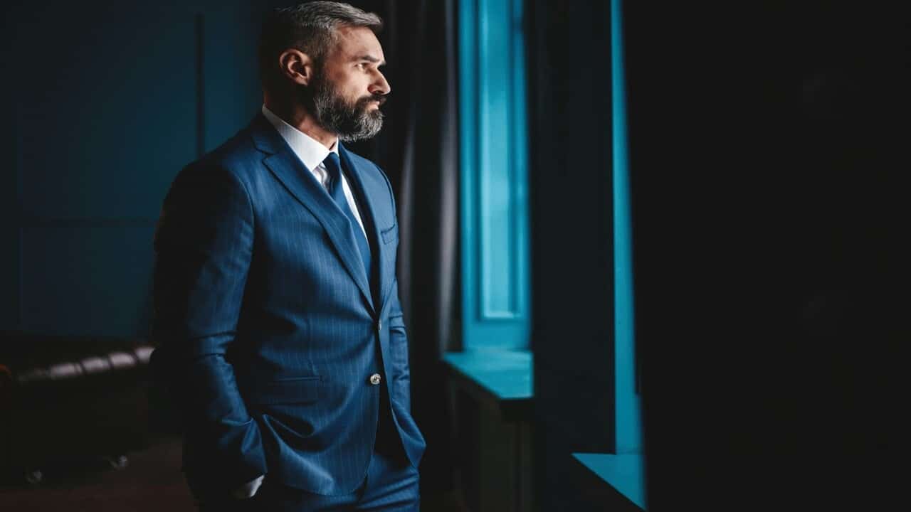 A man looking out the window