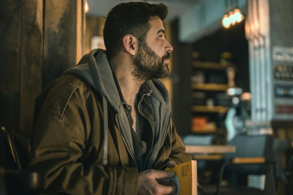 man looking away indoors
