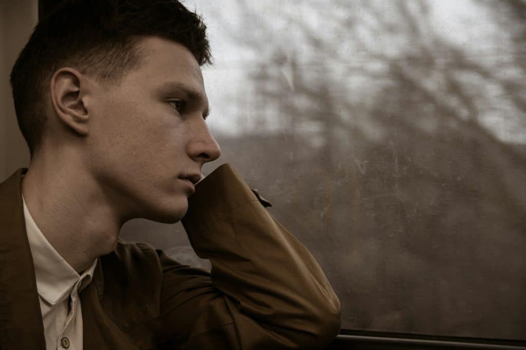 thoughtful man window