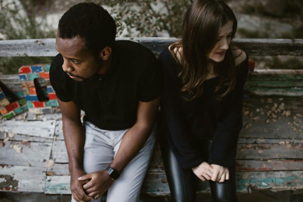 A man and woman looking in the other direction