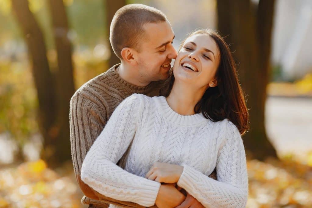 A man and woman laughing together