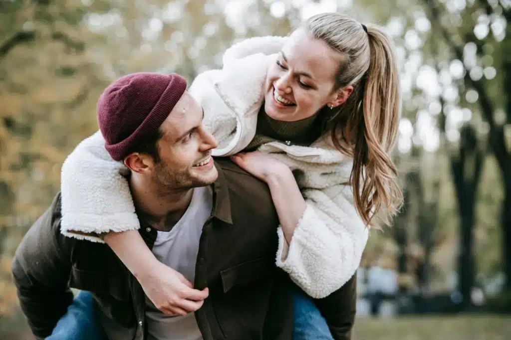 A man carrying woman on his back