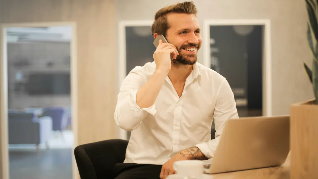 A man on the phone while in the office