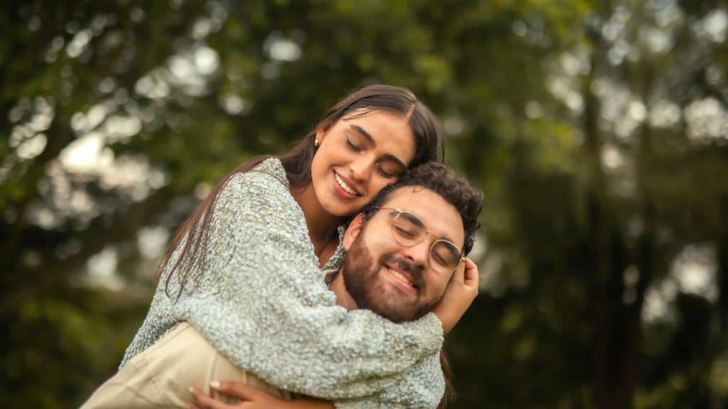 A man holding a woman in his arms.