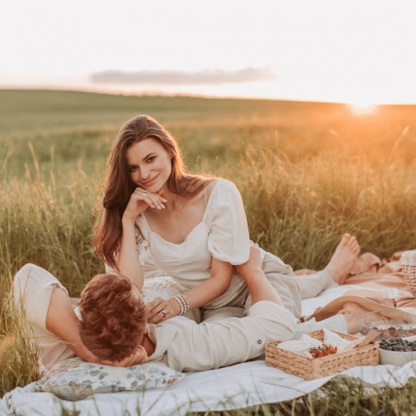 A man and a woman having a picnic