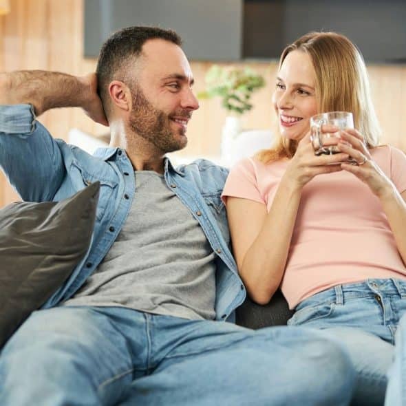 A man and woman looking at each other
