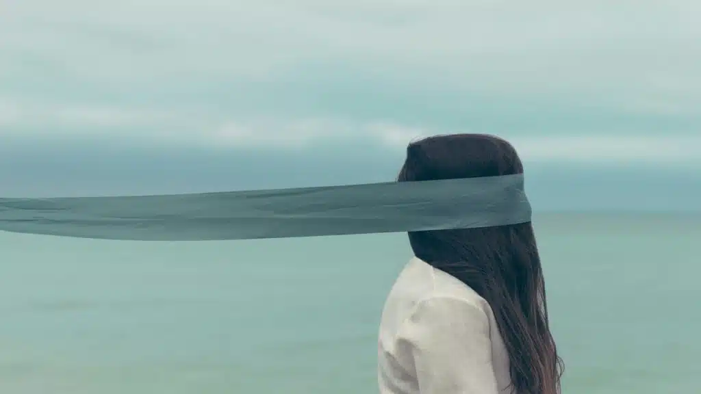 A woman with her eyes covered
