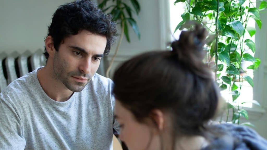 A man looking at the woman