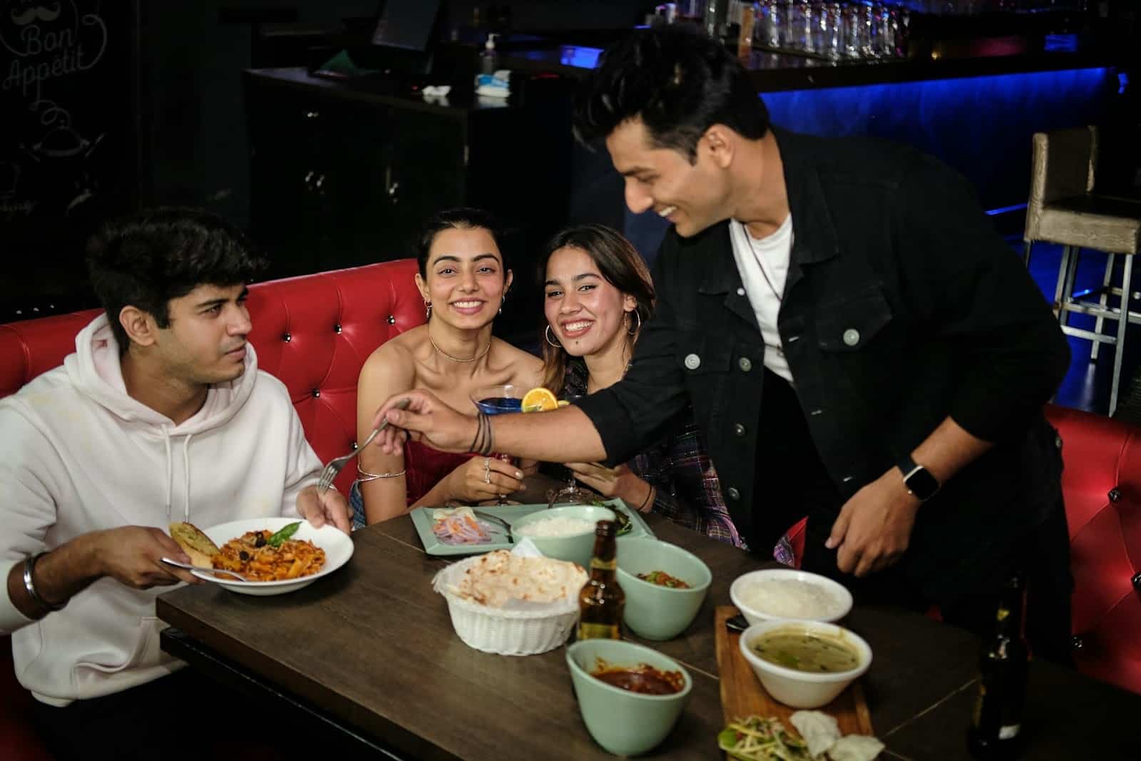 friends laughing bar