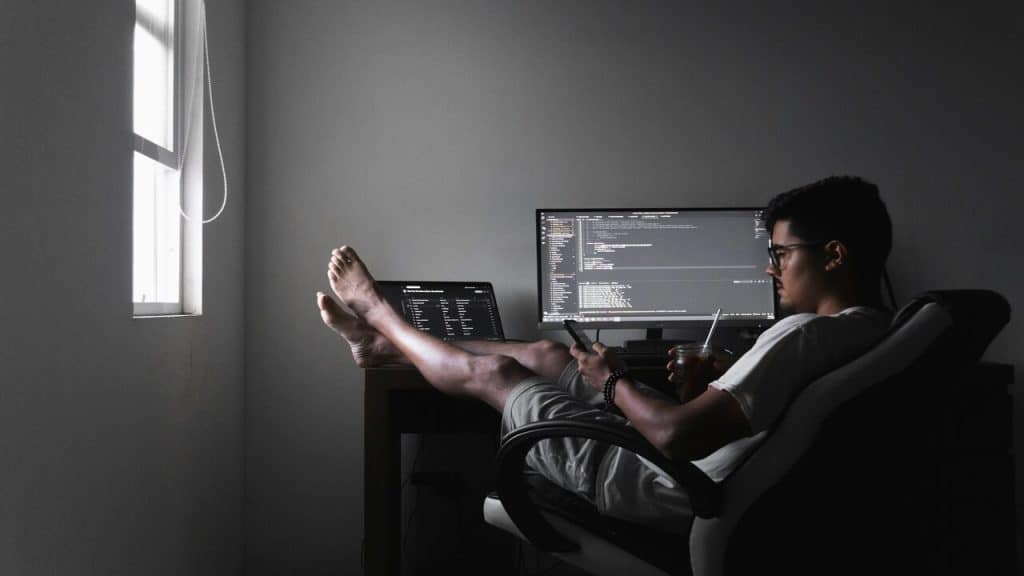 A man relaxing while working from home