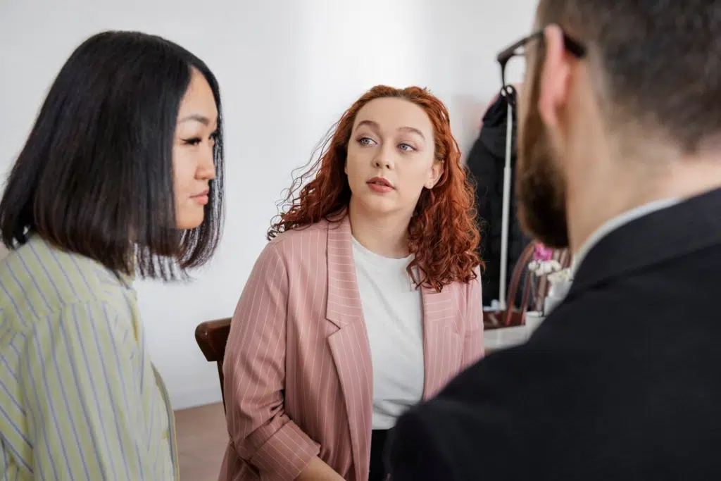 Woman looking at couple with jealousy