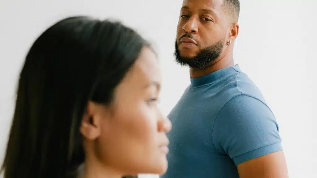 A man and a woman standing next to each other.