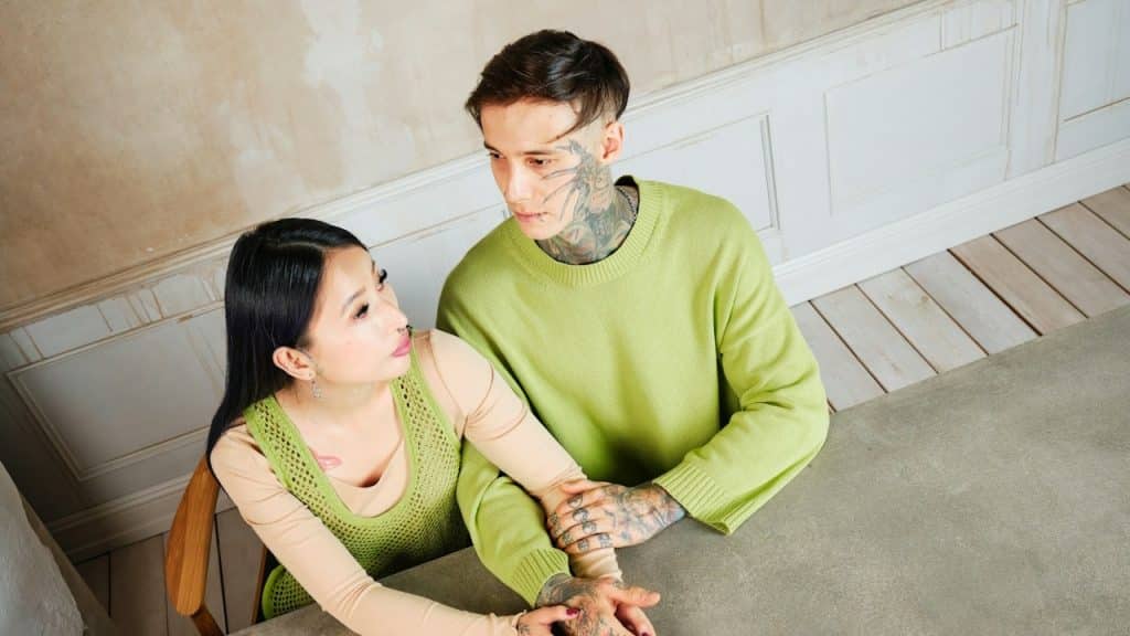 A man and a woman sitting at a table.