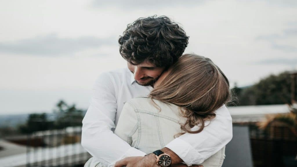 A couple hugging in public