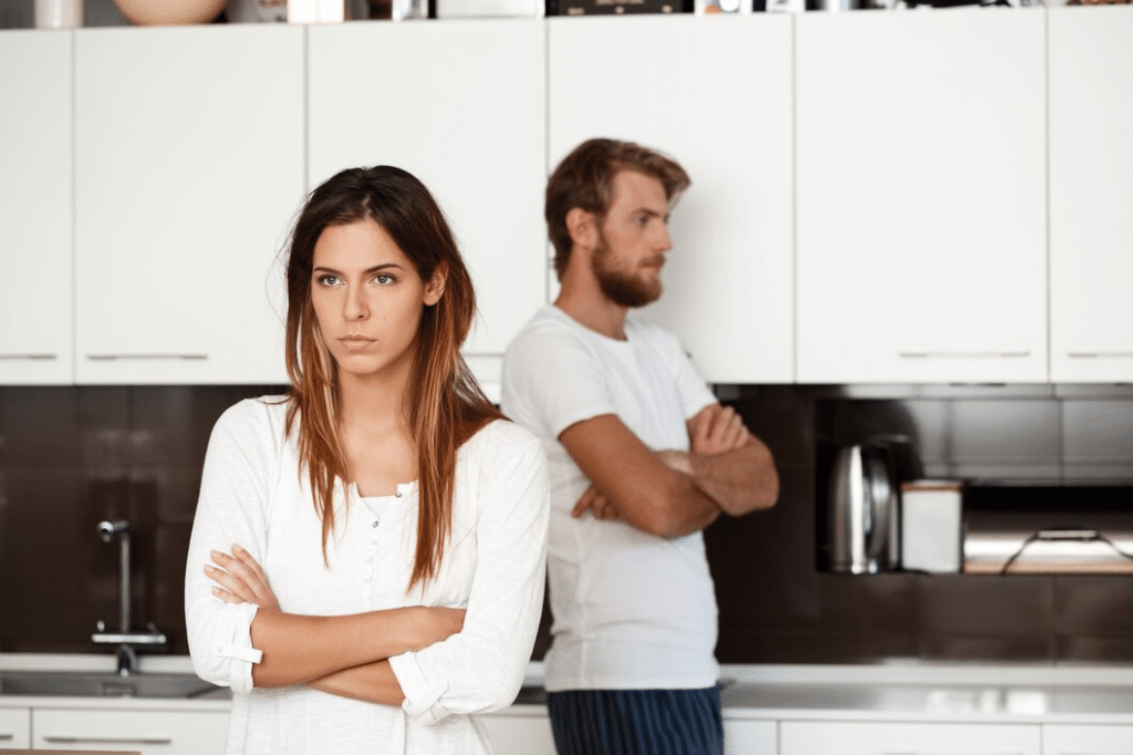 Displeased beautiful brunette girl in quarrel with her boyfriend