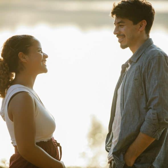 A man and woman smiling at each other