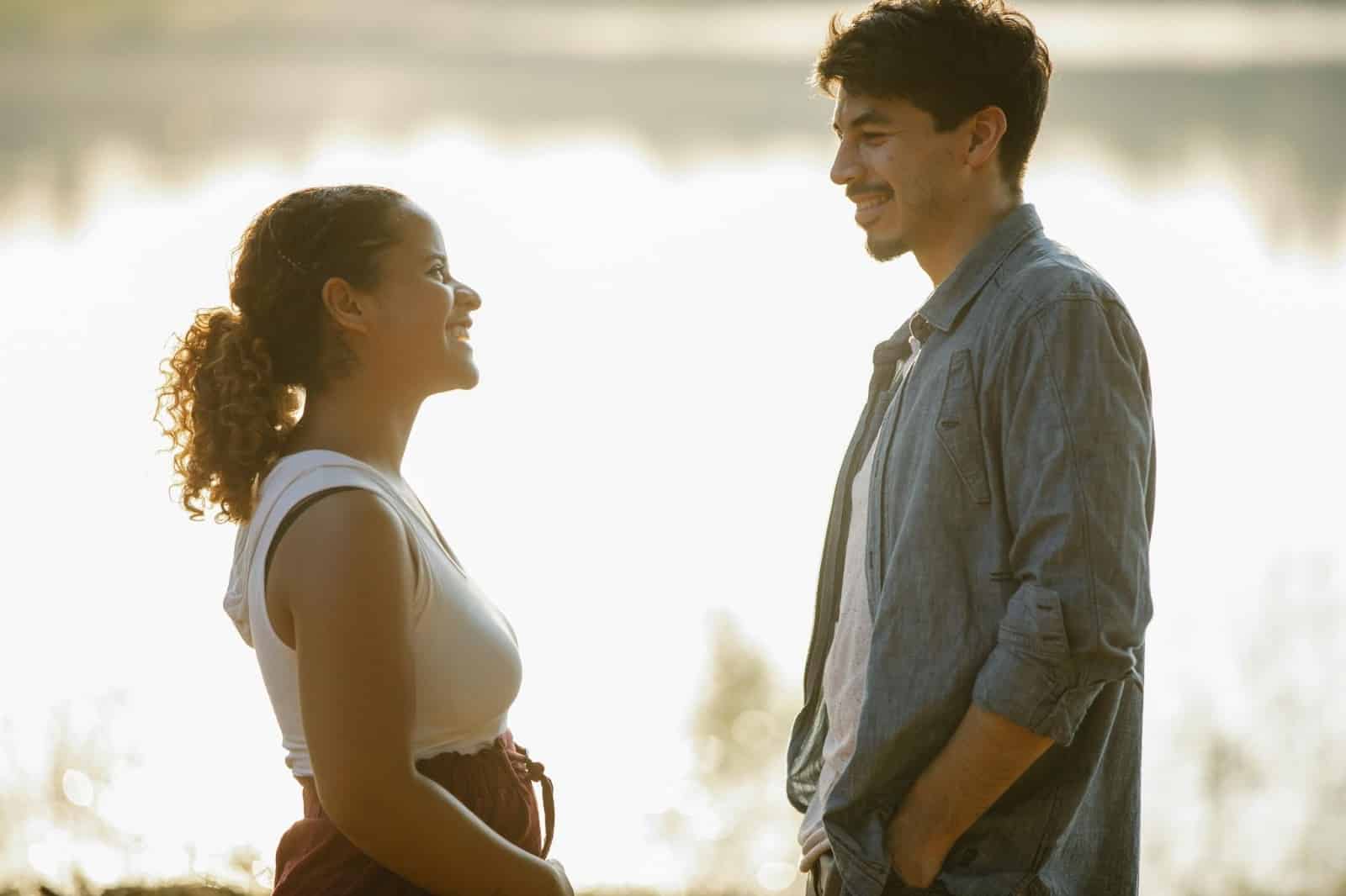 A man and woman smiling at each other