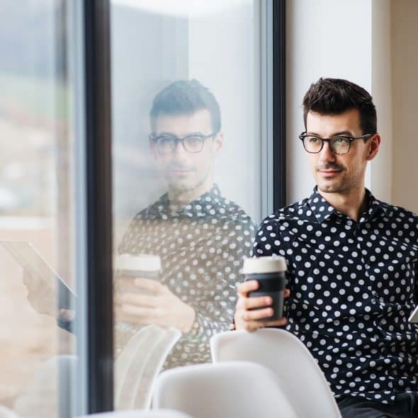 man thoughtful indoors