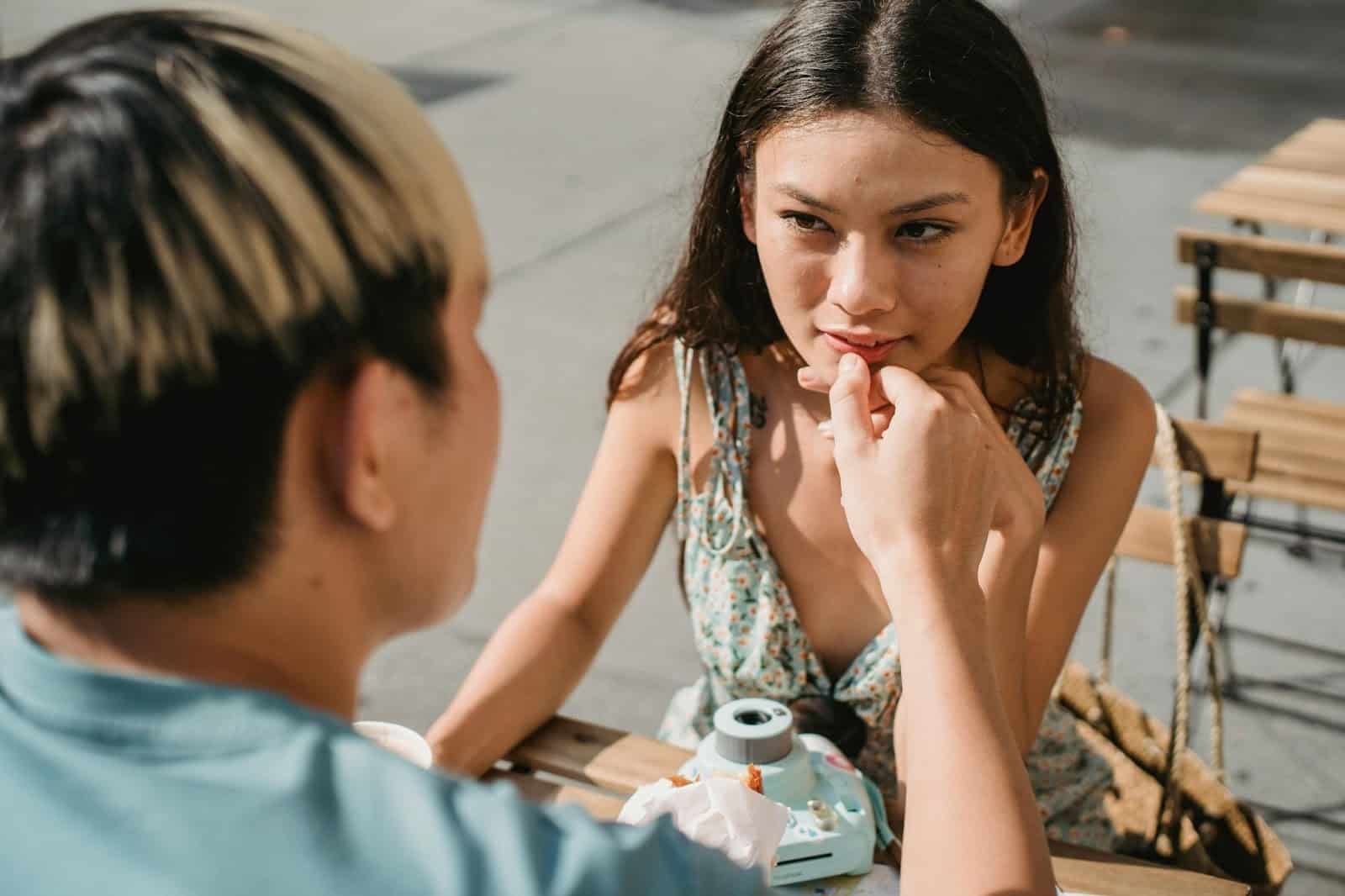 Man holding woman’s chin