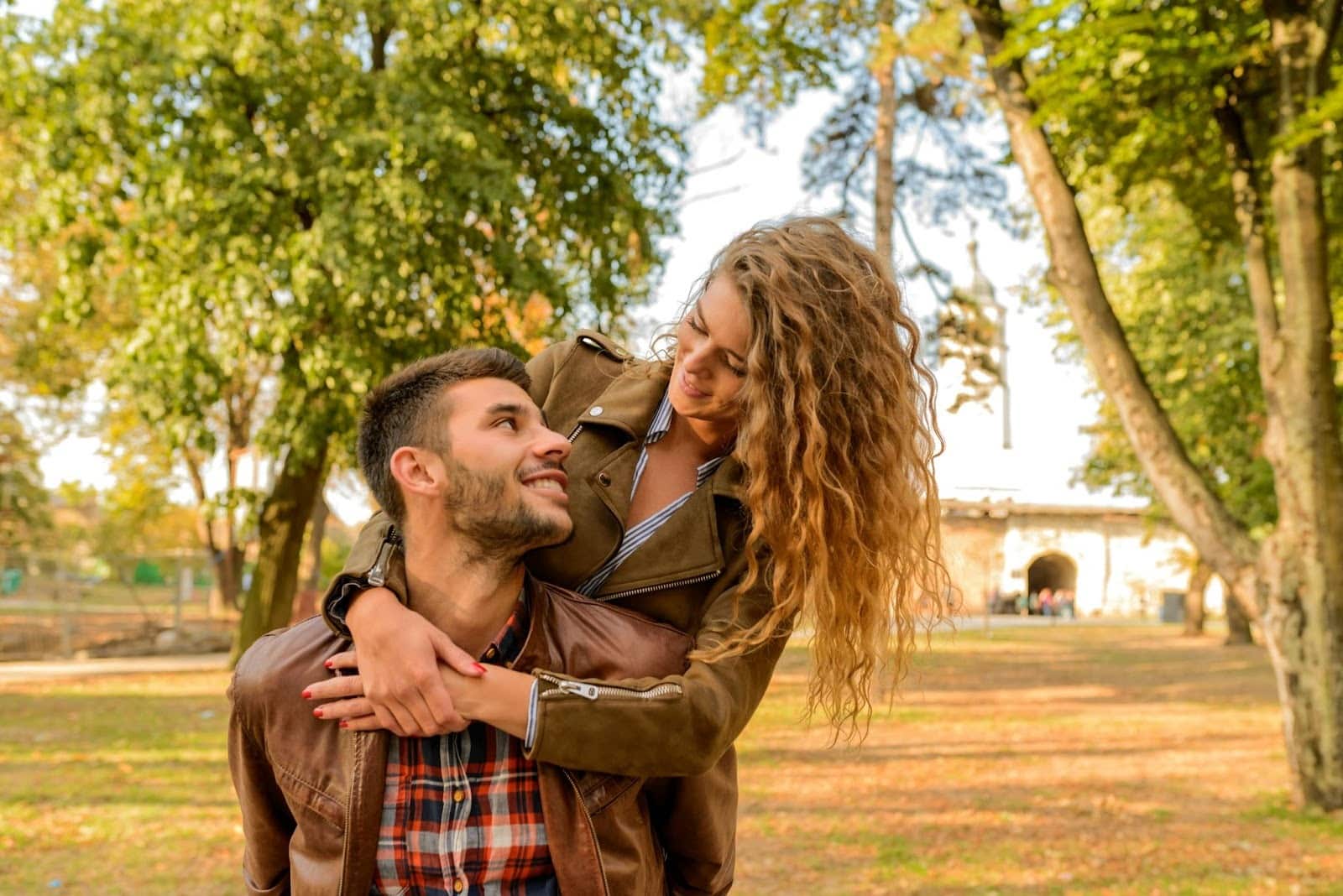 A woman hugging a man