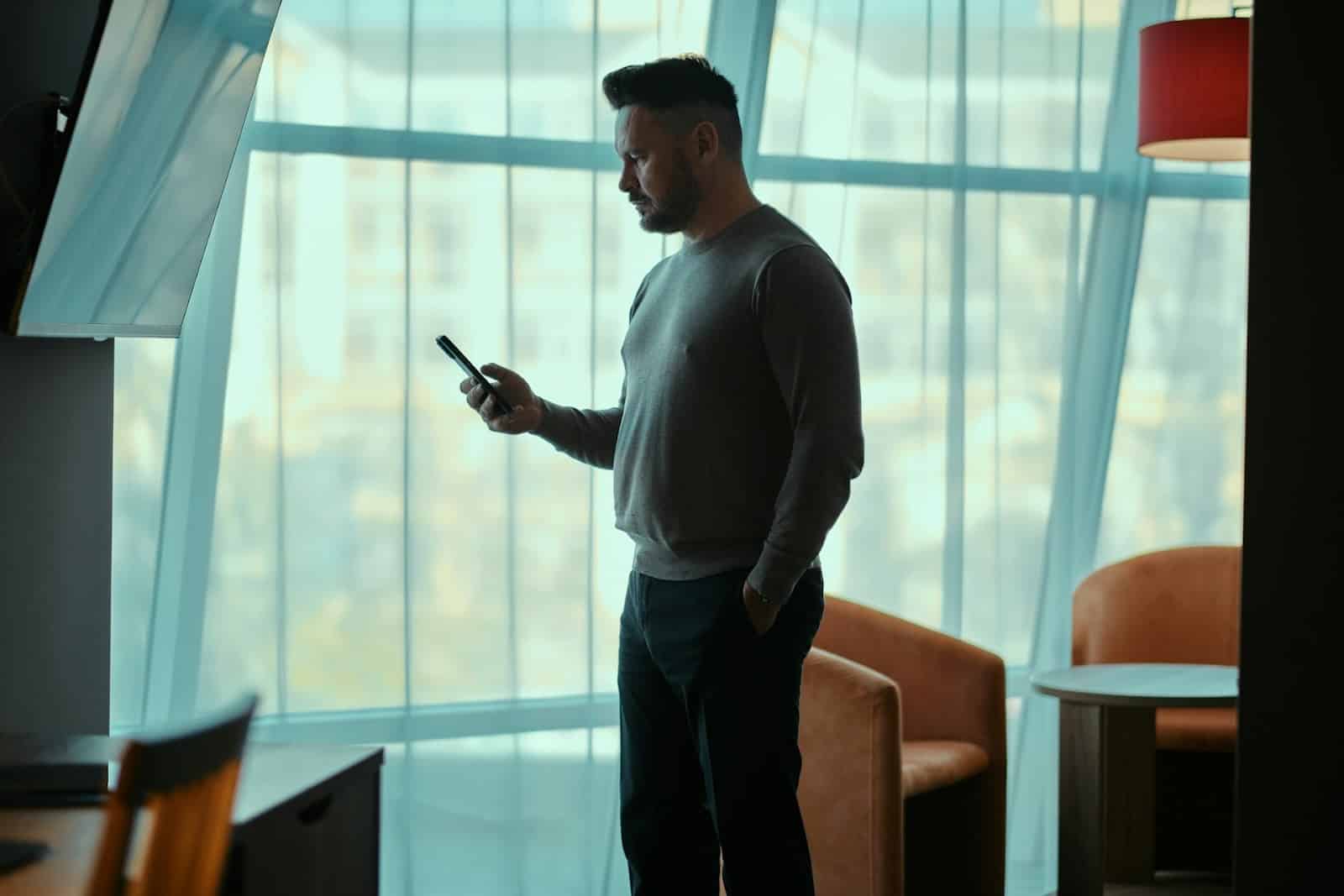 man looking at phone