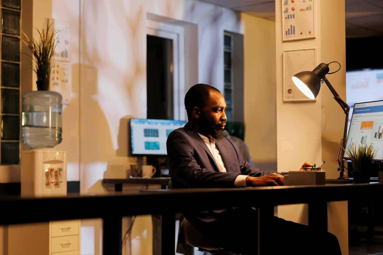 man working late office
