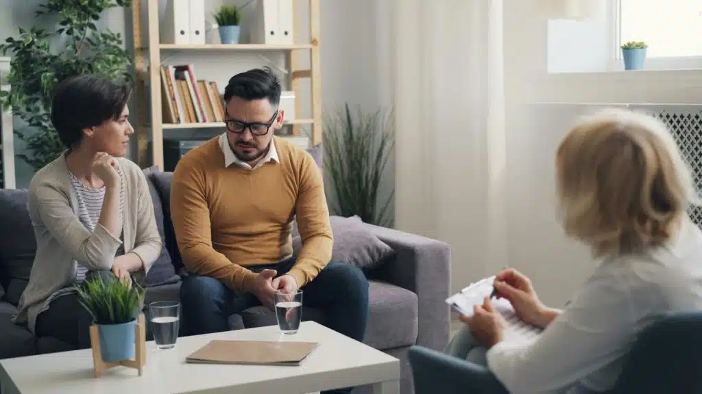 A woman talking to a man