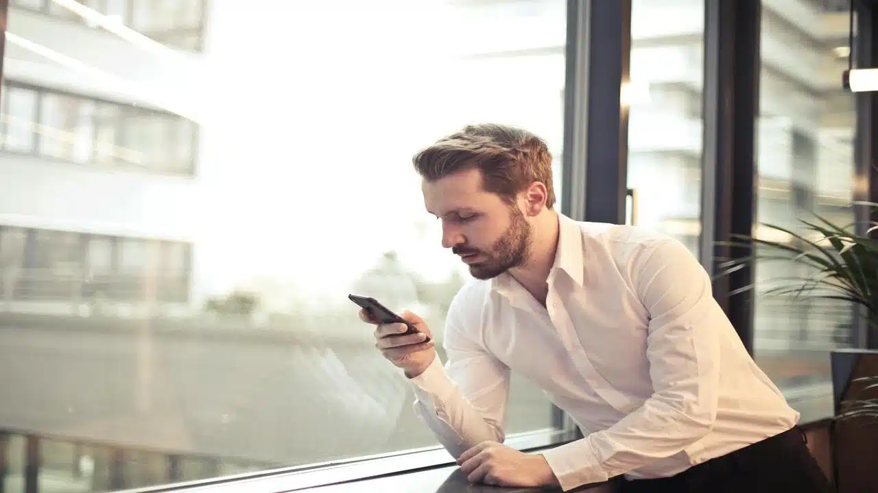 A man texting by himself