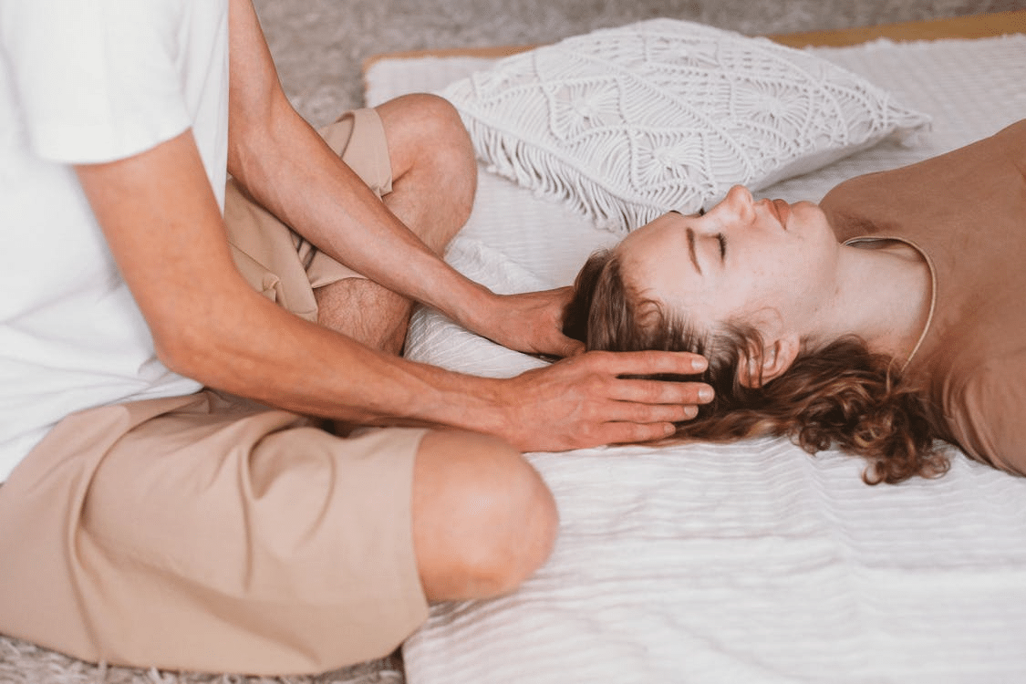 A man massaging a woman