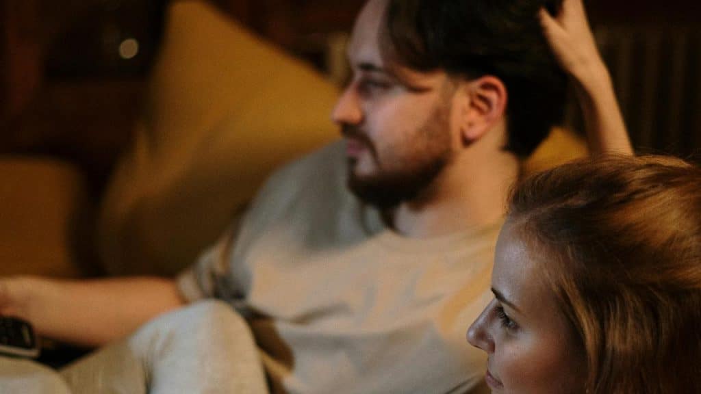 A couple sitting on a couch