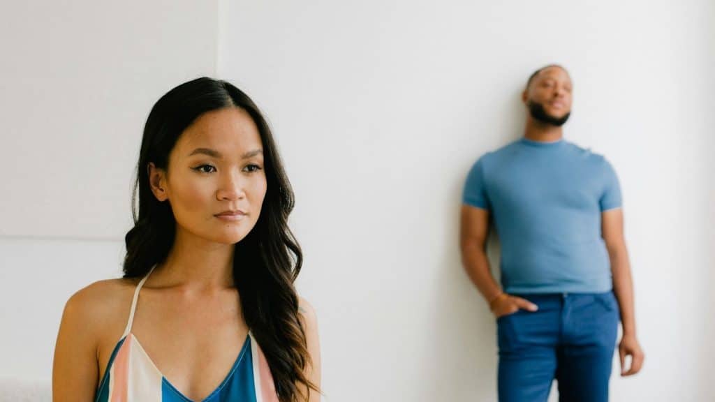 A woman being distant from a man