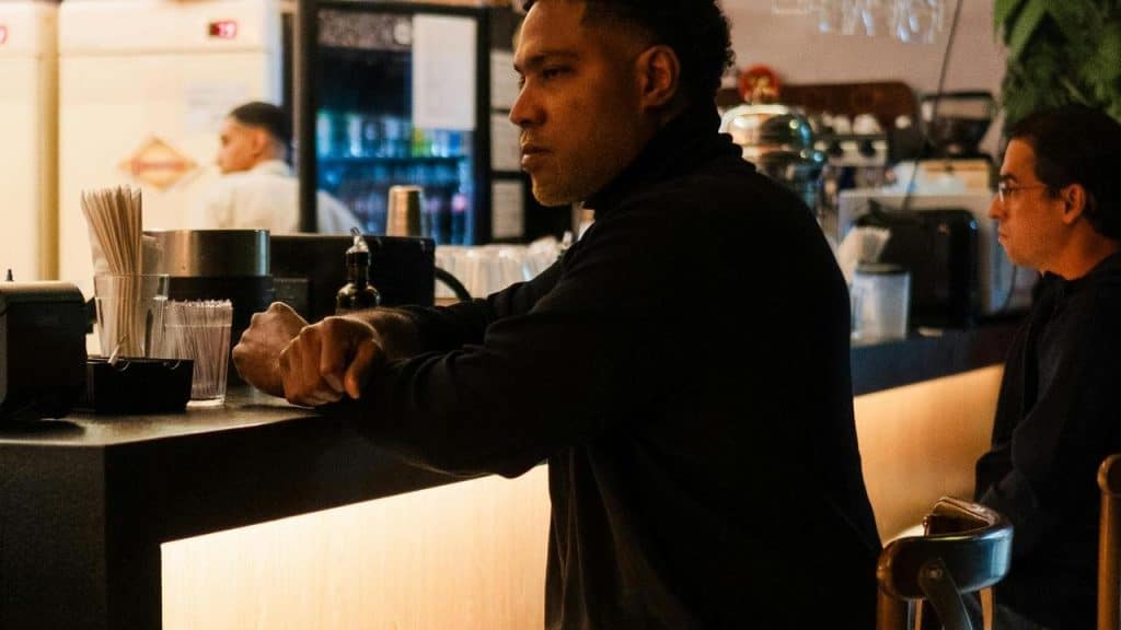 A man leaning on a counter 
