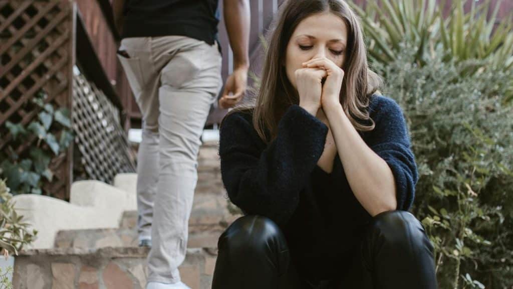 A woman sitting on outdoor steps