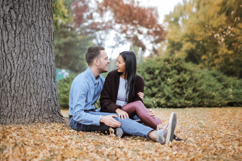 A couple sitting under the tree