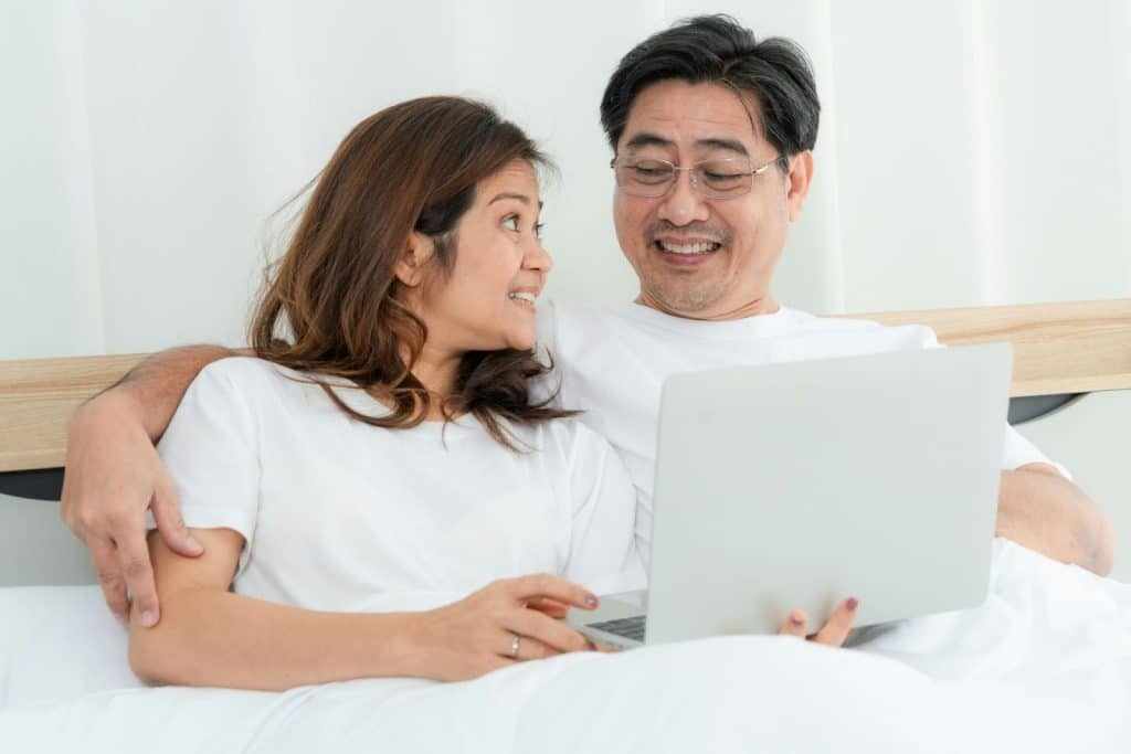 Woman smiling awkwardly to a man