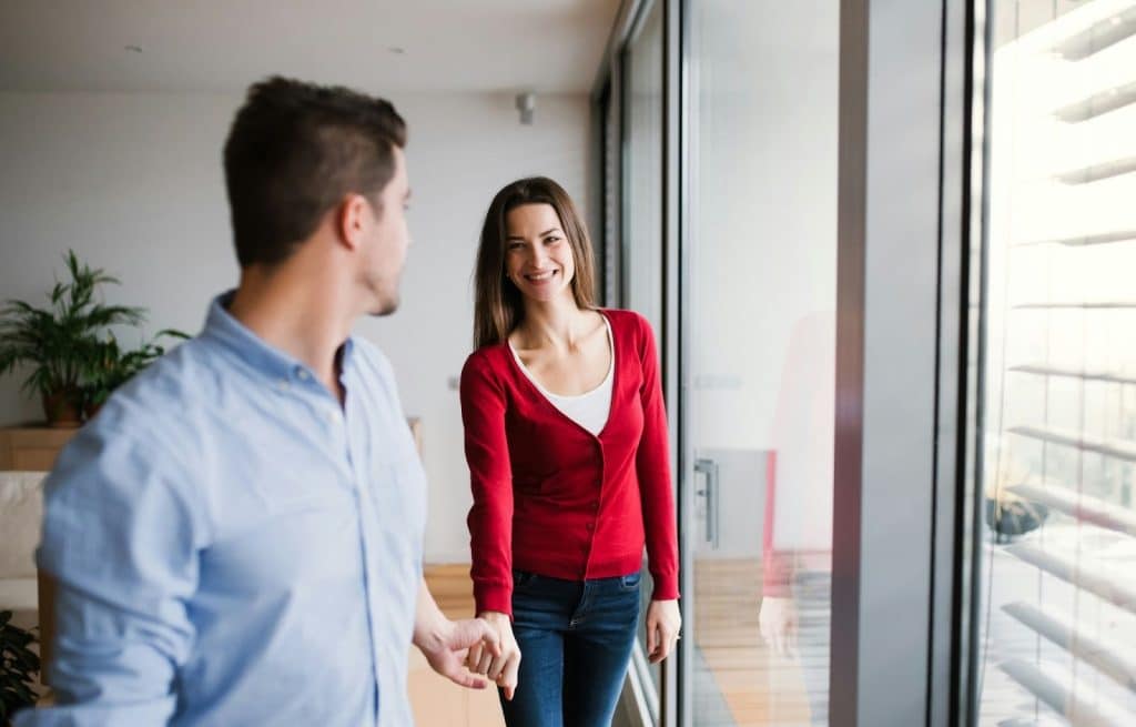 A man holding a woman’s hand