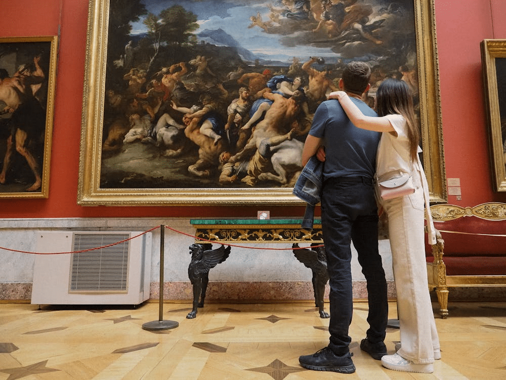 A couple looking at a painting