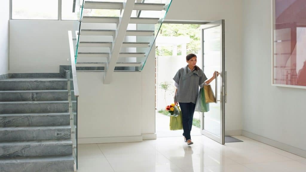 A woman entering a home without invitation