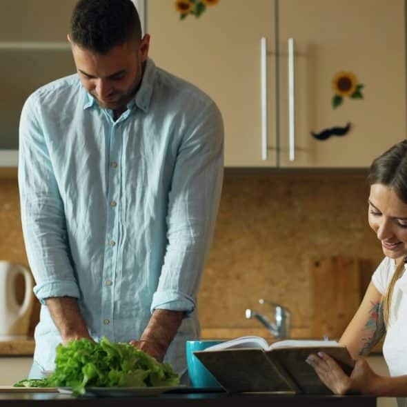 A couple busy with chores at home