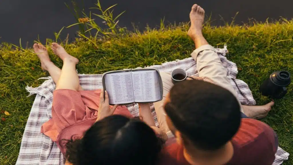 A couple reading the bible together