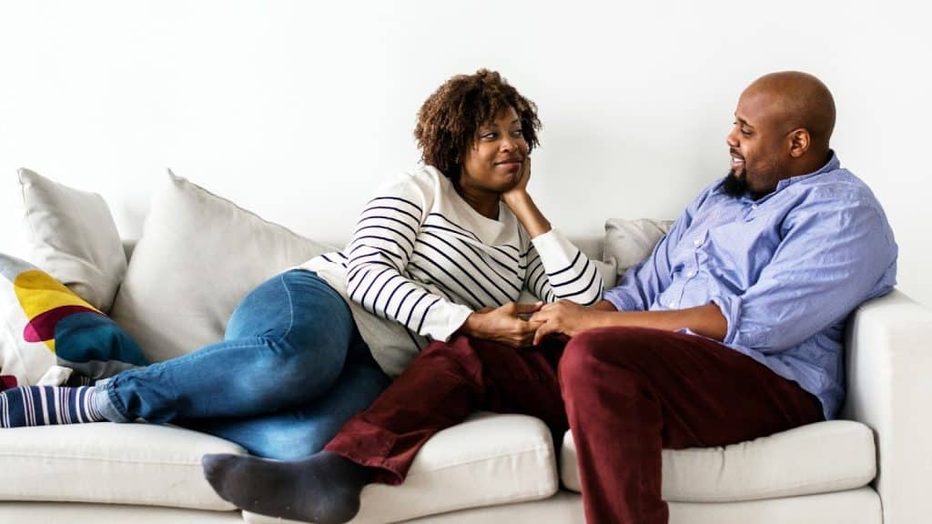 A man and woman at couch