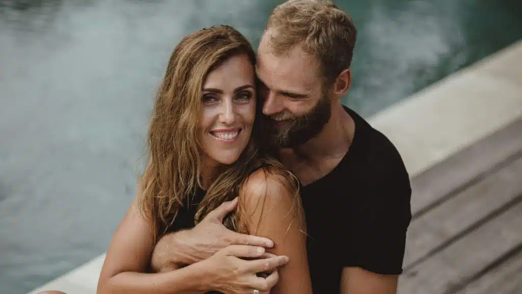 A man hugging a woman