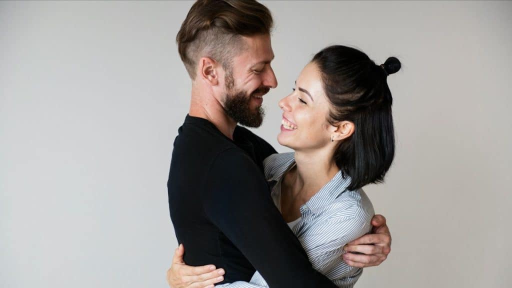 A man and woman hugging each other