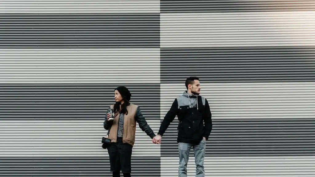 A man and a woman holding each other's hand.