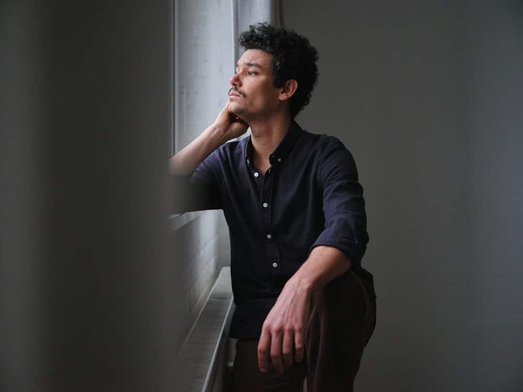 man thoughtful indoors