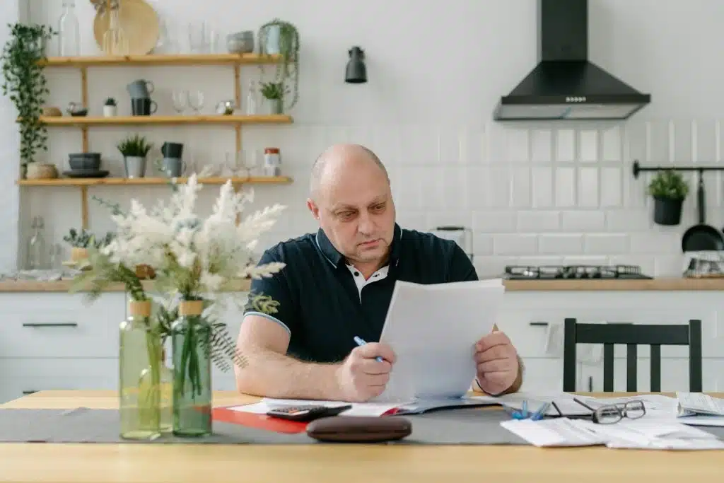 man reviewing bills