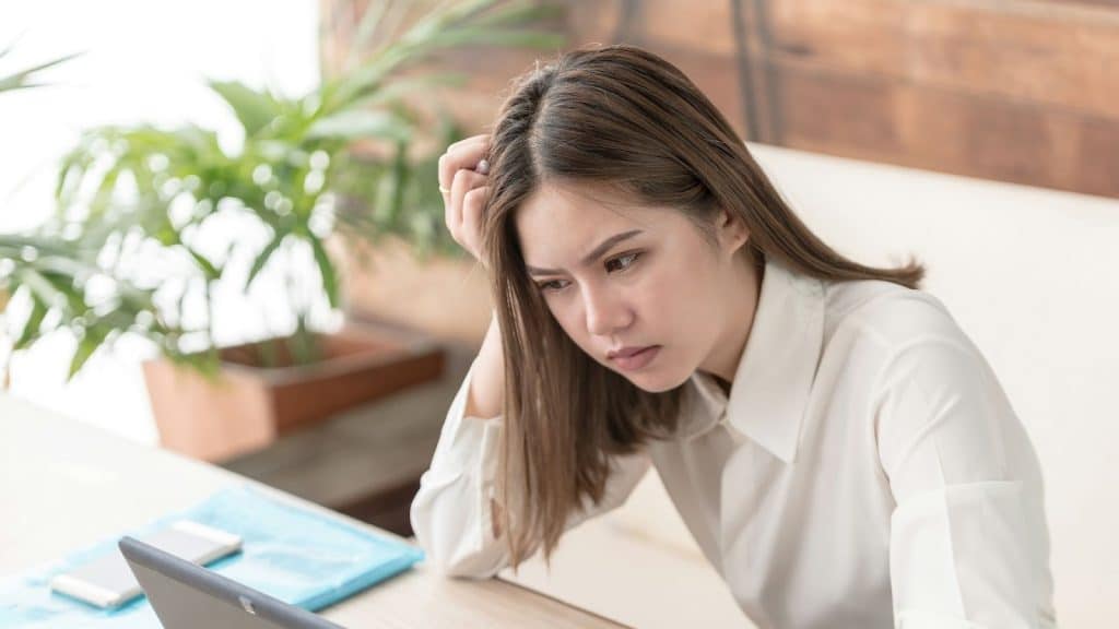 Woman looking worried and cannot focus